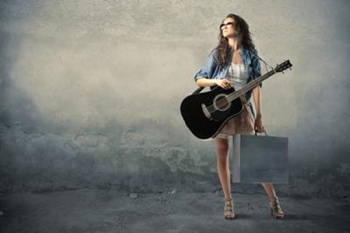 woman with guitar and suitcase