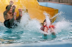 kids emerging from waterslide