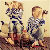 boy and girl with binoculars