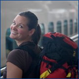 young woman, backpack, train station