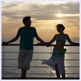 couple aboard cruise ship at sunset