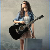 young woman with guitar and suitcase