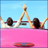 happy couple pink convertable